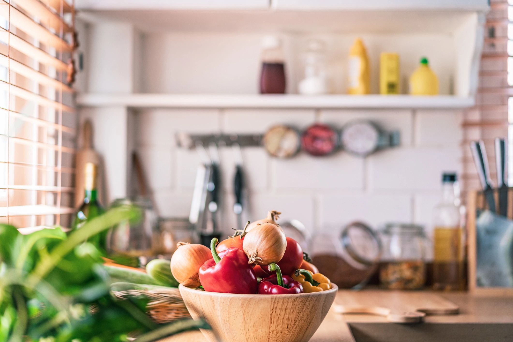 Sunlit kitchen counter with fresh organic vegetables