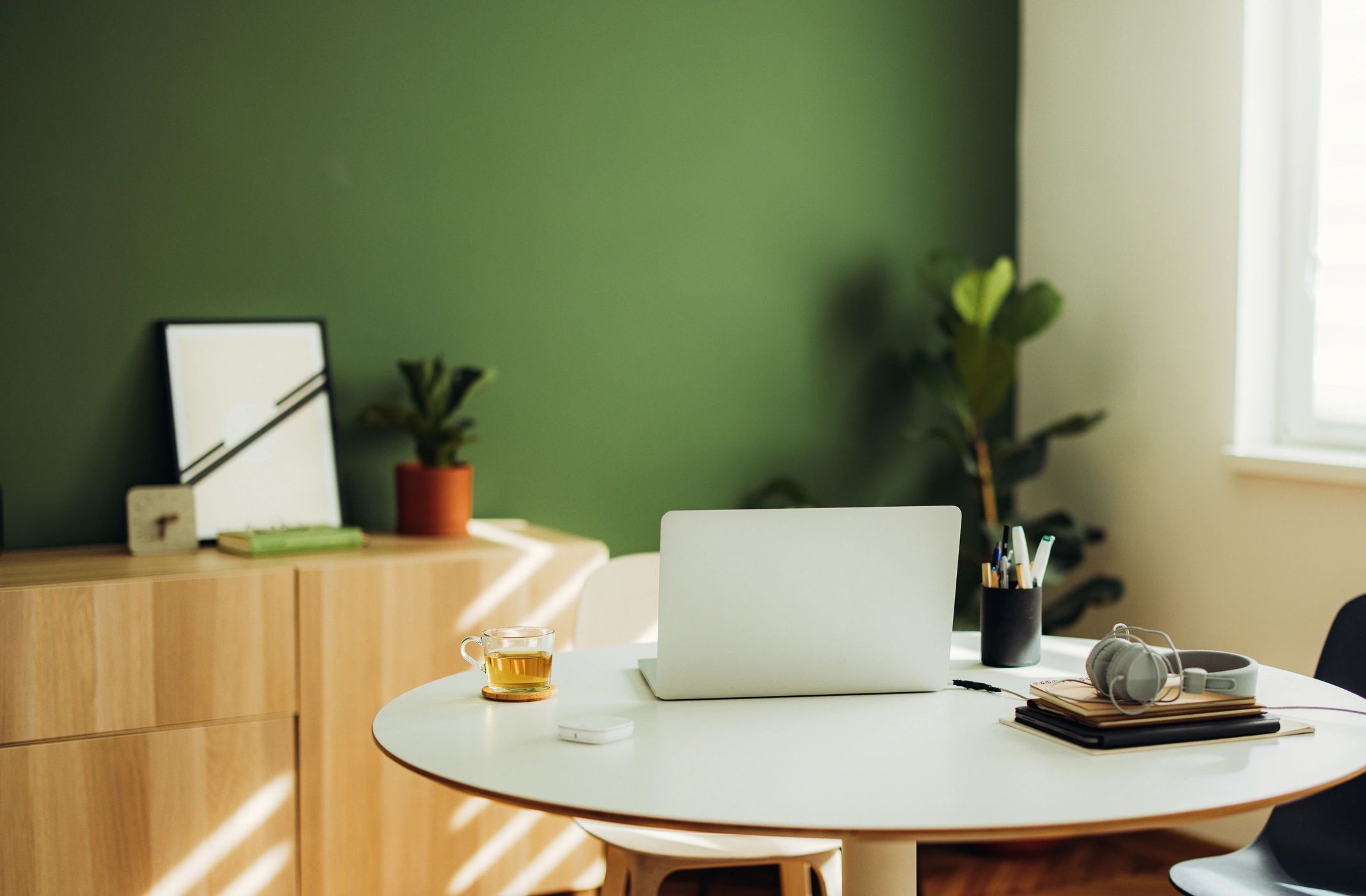 Minimal wellness workspace with laptop and tea