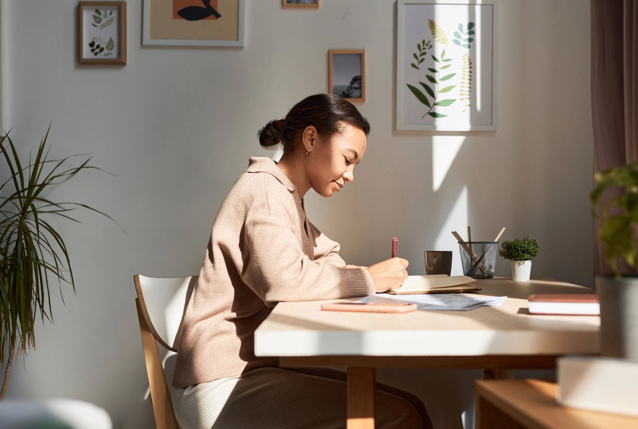 Kristen-style wellness portrait journaling in warm morning light