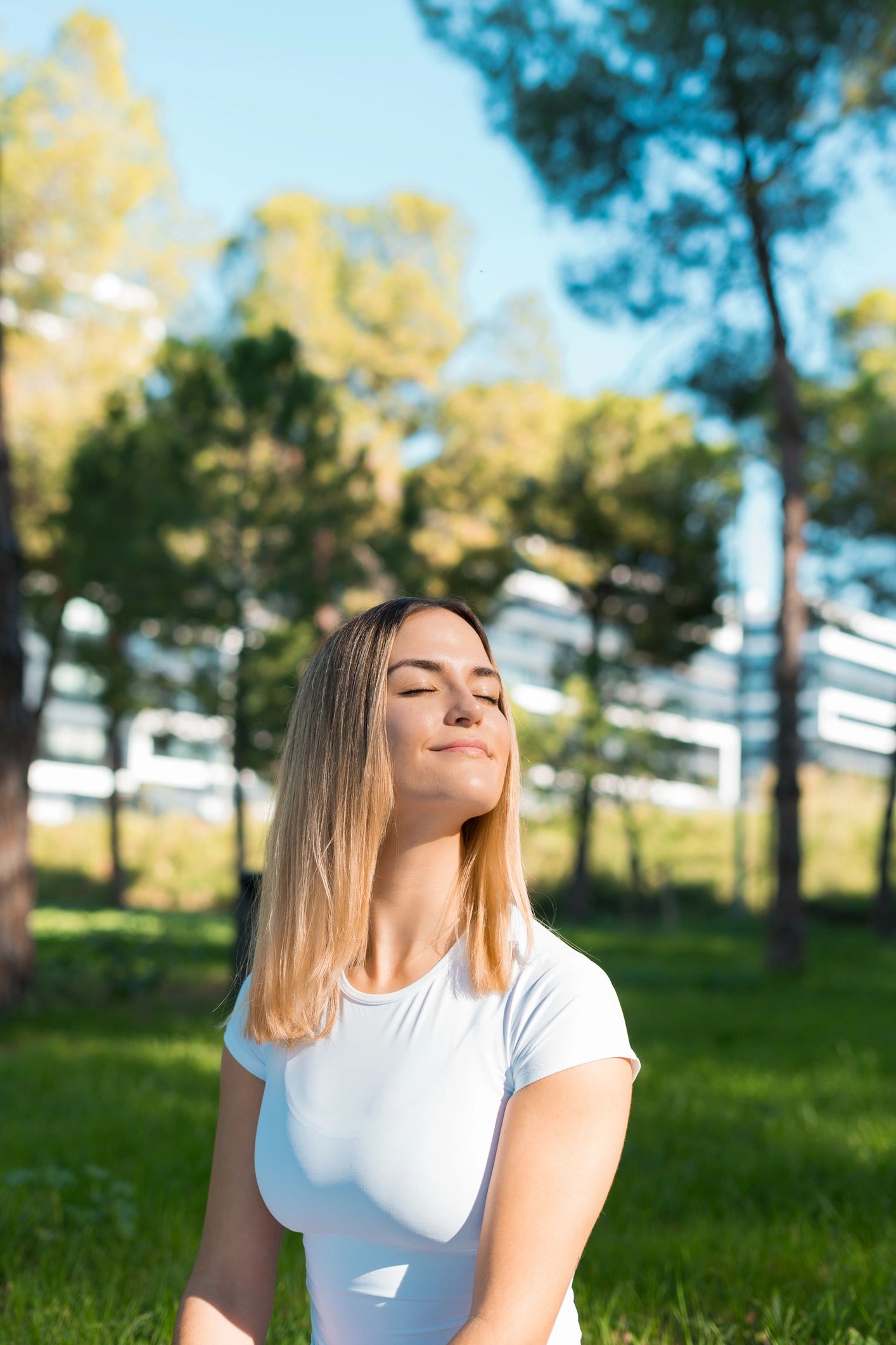Woman meditating outdoors in a peaceful park
