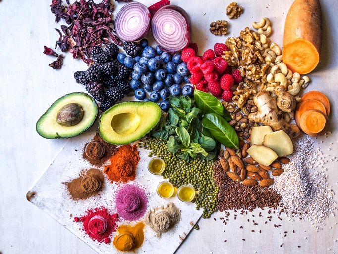 Colorful vegetables and healthy ingredients on a wooden table